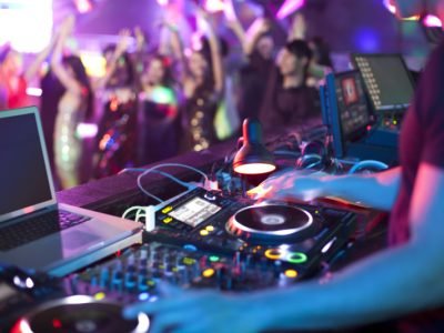 DJ doing record Scratching in nightclub